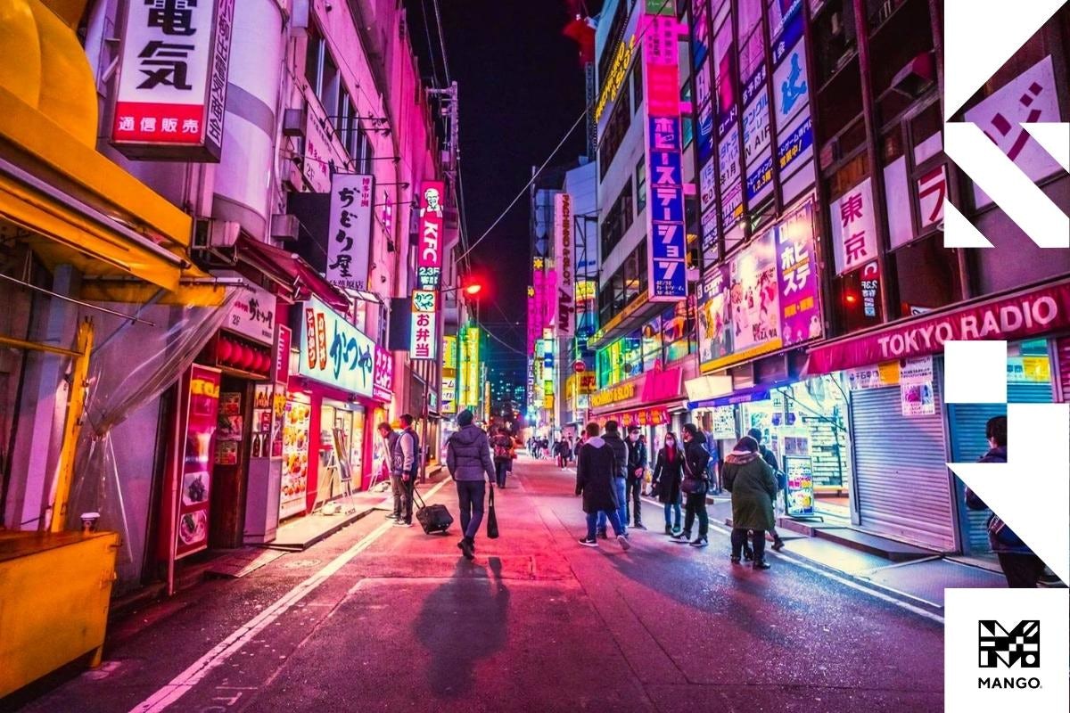 A busy Japanese city street filled with stores and signs