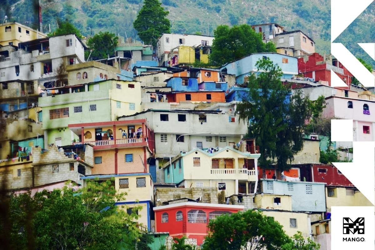 A lot of colorful houses on the sloping side of a hill